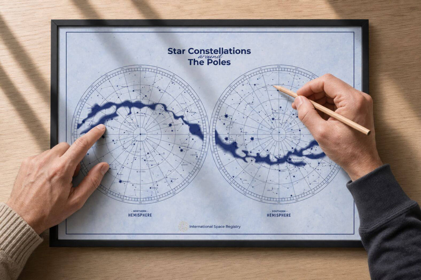Two people comparing northern and southern constellation charts